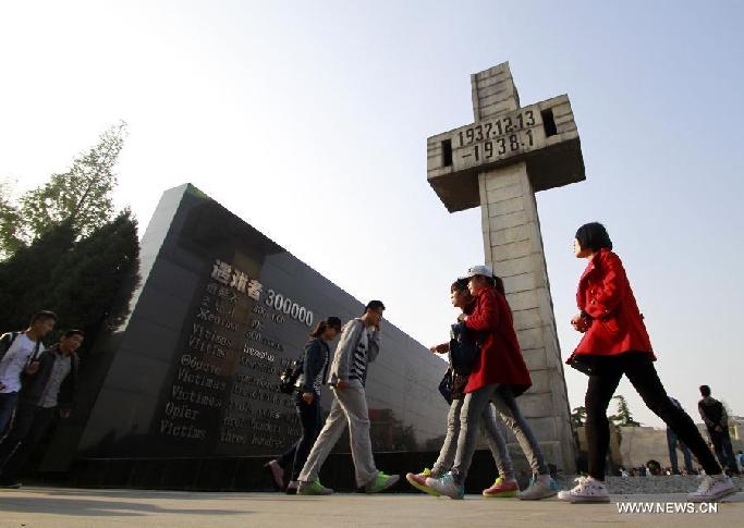 People come to mourn the Nanjing Massacre victims at the Memorial Hall of the Victims in Nanjing Massacre by Japanese Invaders in Nanjing, capital of east China's Jiangsu Province, April 5, 2014, on the occasion of the Qingming Festival, or the Tomb-Sweeping Day.