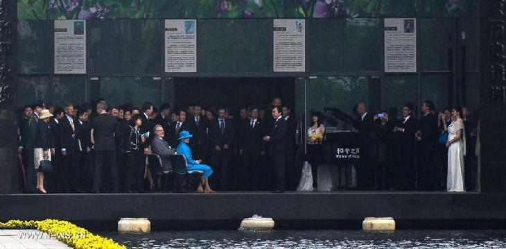 Queen of Denmark Margrethe II listens to a song performed by staff members of the Memorial Hall of the Victims in Nanjing Massacre by Japanese Invaders, in Nanjing, capital of east China's Jiangsu Province, April 27, 2014.