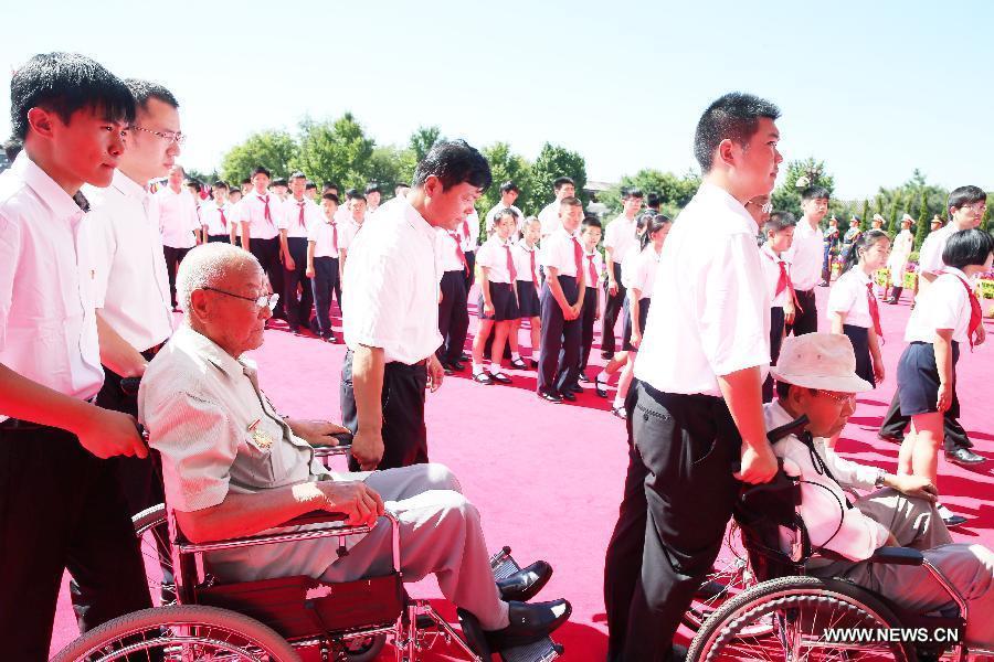 Veterans attend a ceremony to mark the 69th anniversary of the Victory Day in the Anti-Japanese War at the Museum of the War of the Chinese People's Resistance Against Japanese Aggression in Beijing, capital of China, Sept. 3, 2014.