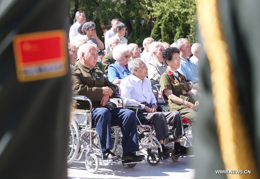 Veterans attend a ceremony to mark the 69th anniversary of the Victory Day in the Anti-Japanese War at the Museum of the War of the Chinese People's Resistance Against Japanese Aggression in Beijing, capital of China, Sept. 3, 2014.